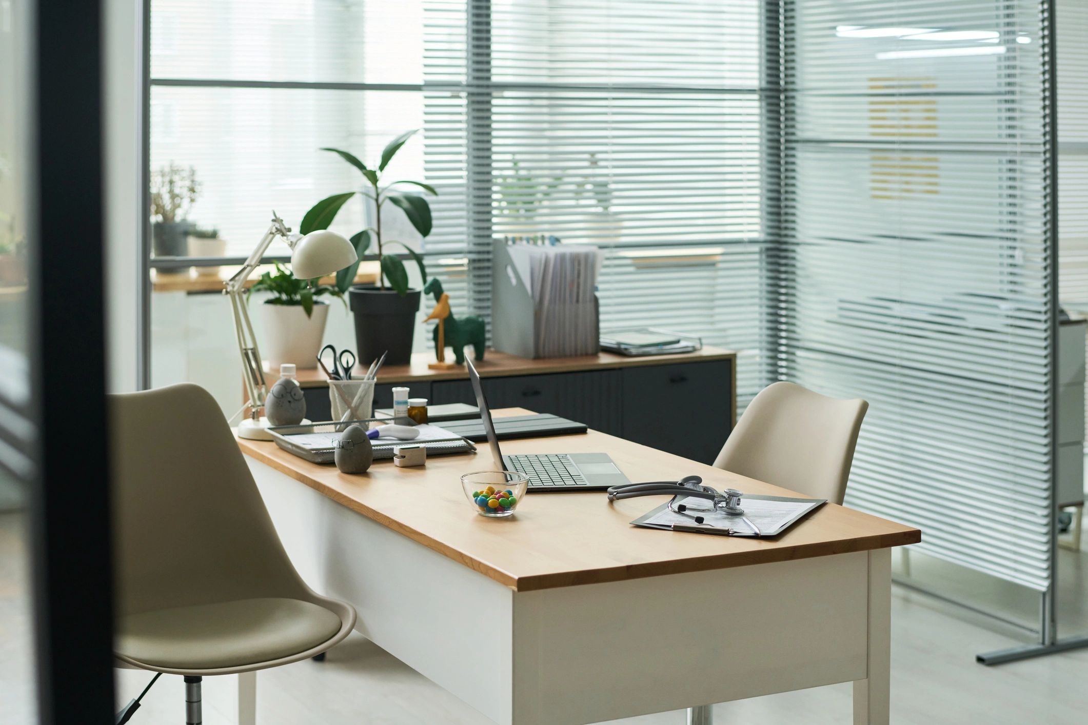 Desk with laptop and paperwork representing online business privacy and data handling